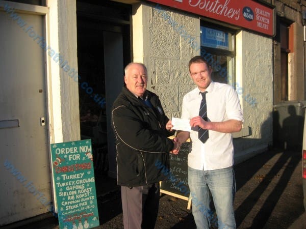 Kris Davidson with Loons Director Dennis Fenton 20131118lotterywinner